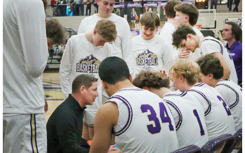 Lumpkin County Head Coach Chris Faulkner talks strategy with his team as they take on the Tigers.