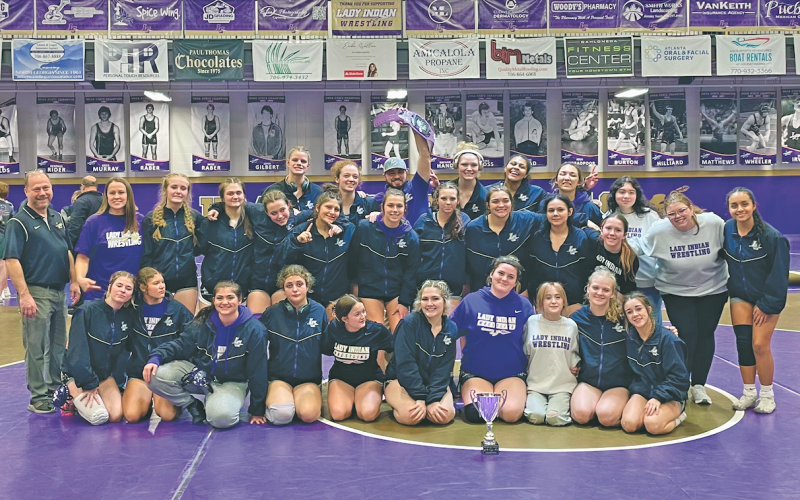 The Lumpkin County Girls Wresting Team celebrates its Area Championship victory.
