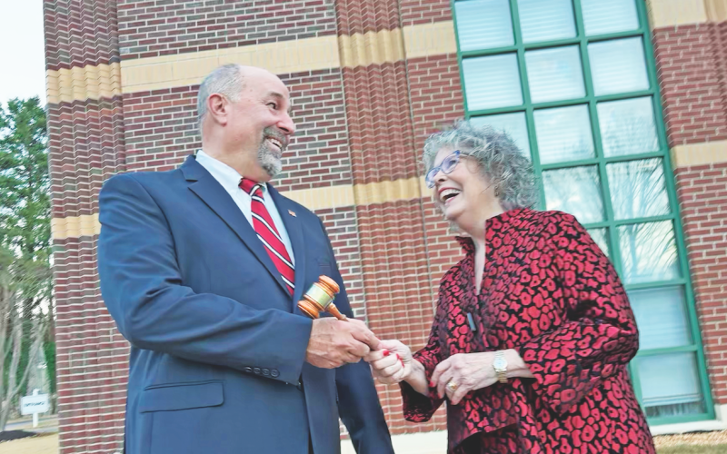 JoAnne Taylor hands off the gavel to Mayor Sam Norton at City Hall before the meeting in a photo-friendly setting at The Nugget’s request.