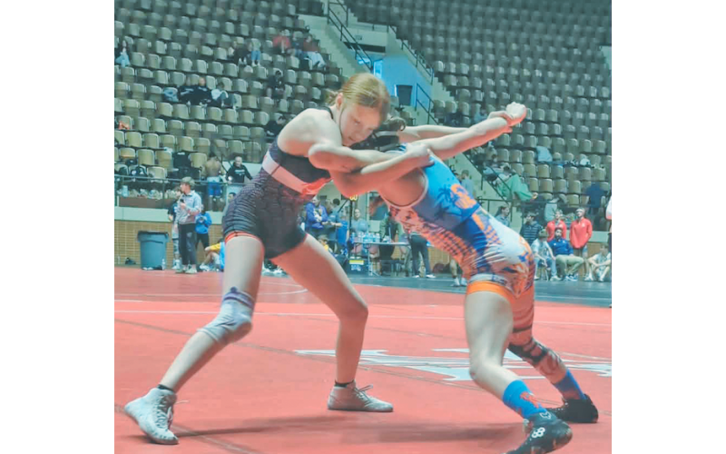 Allie Proctor (left) looks for an opening in her opponent’s defense during competition.