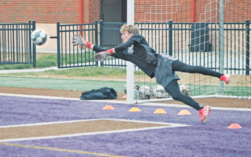 Lumpkin County goalie Chance Sprague dives for a block durning a practice drill.