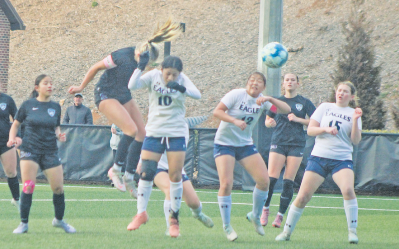 Lumpkin County standout Kaitlyn Johnson angles a header during a recent game.