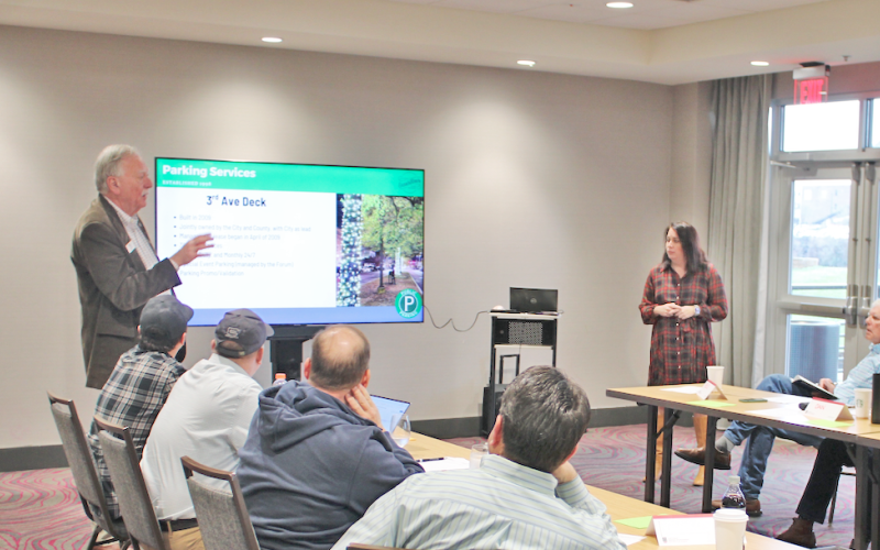 Rome Mayor Jim Boho and Downtown Development Authority Director Suzanne Roberts review parking solutions with the visiting Dahlonega City Council during a retreat earlier this year.