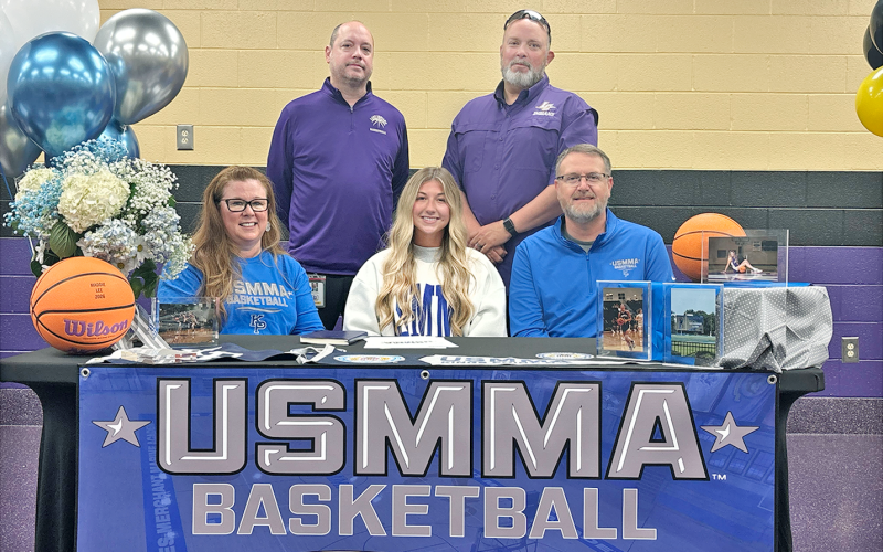 Local basketball star Maddie Lee signs her official commitment to the U.S. Merchant Marine Academy.