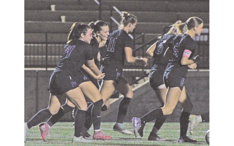 Sophia Manisy and Carlie Fugich celebrate a Lumpkin County goal together.