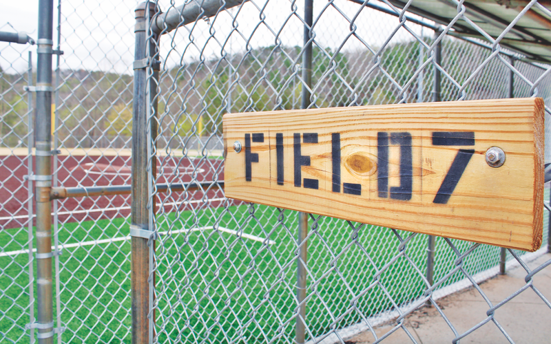 New signage hangs on the entrance to the Field 7 dugout, one of four Clover Leaf fields that have re-opened following the addition of artificial turf and other renovations.