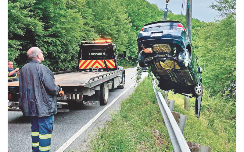 No major injuries were reported after the driver of a Ford Focus jumped the guardrail on Highway 60 and landed in the Chestatee River on Saturday morning. But it still made for a tricky towing job as, from left, Eddie Nicholson and Keith Rider assist Travis Glover, not pictured, of Travis Tow Patrol.