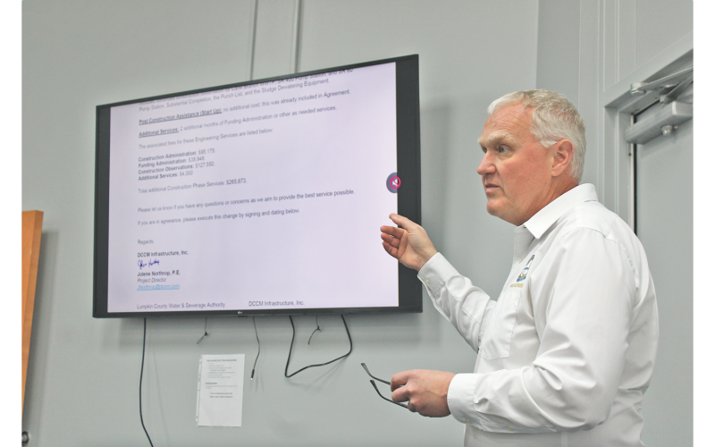 Water and Sewage Authority Executive Director Sean Phipps gestures toward a letter from DCCM requesting a six month extension and $265,673 in additional construction phase services to complete the Cane Creek Wastewater Treatment Plant.