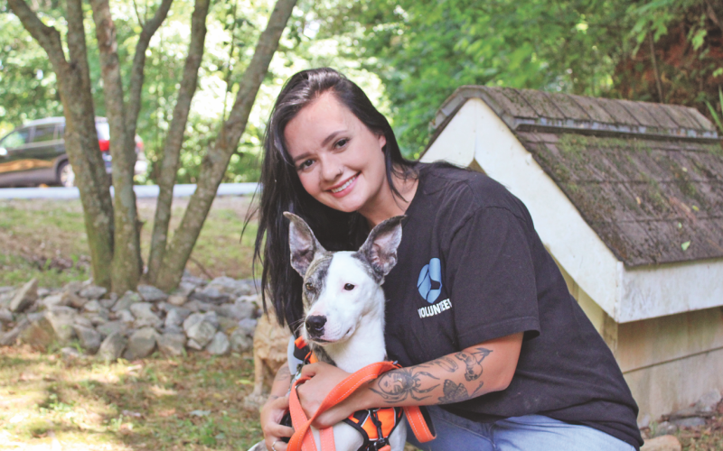 Friends of Lumpkin County Shelter Animals President Savana Borchers spends some quality time with one-year-old shelter dog Honda.
