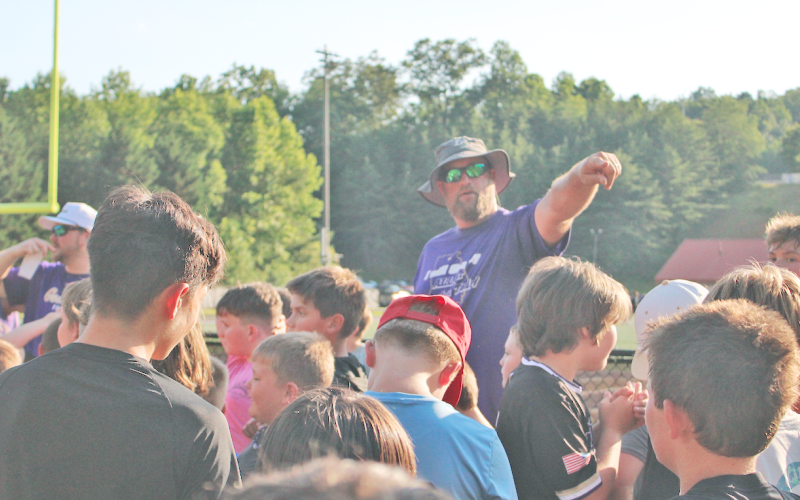Assistant Coach Jake Estenson directs young participants during the recent summer camp.