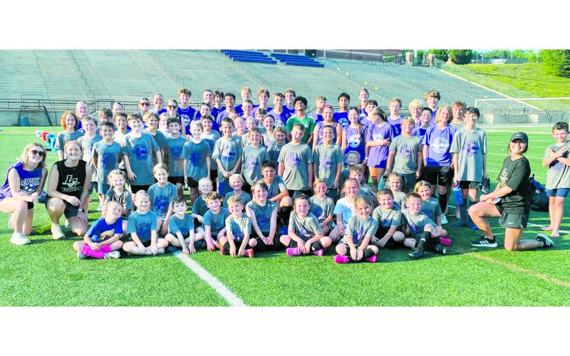 Lumpkin soccer campers, coaches and athletes gather for a celebratory group photo on the last day of camp.