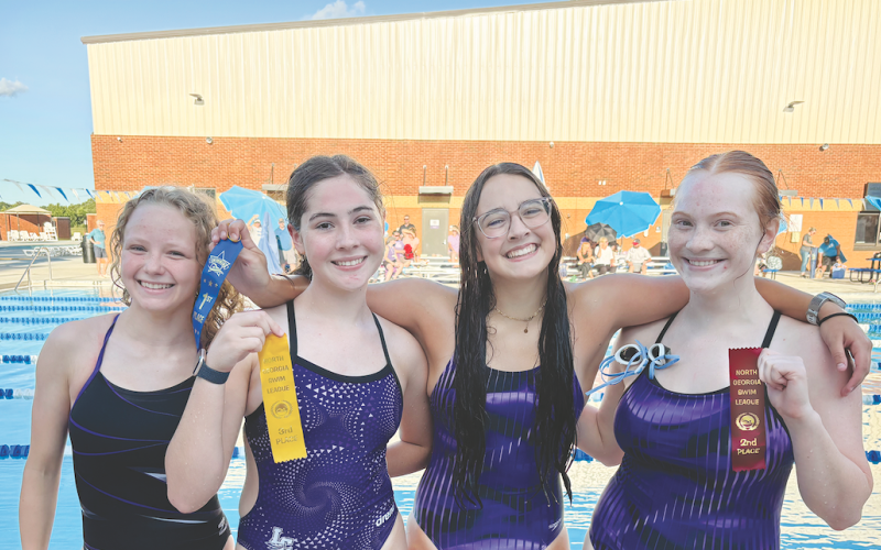 Pictured, from left, Ellie Moye, Abigail Herrit, Amelia Turk and Madison Barrick celebrate their finishes after facing off in a recent race.