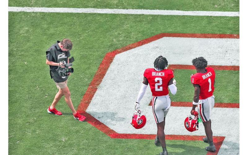 LCHS graduate Sam Edwards works the camera during a UGA game.