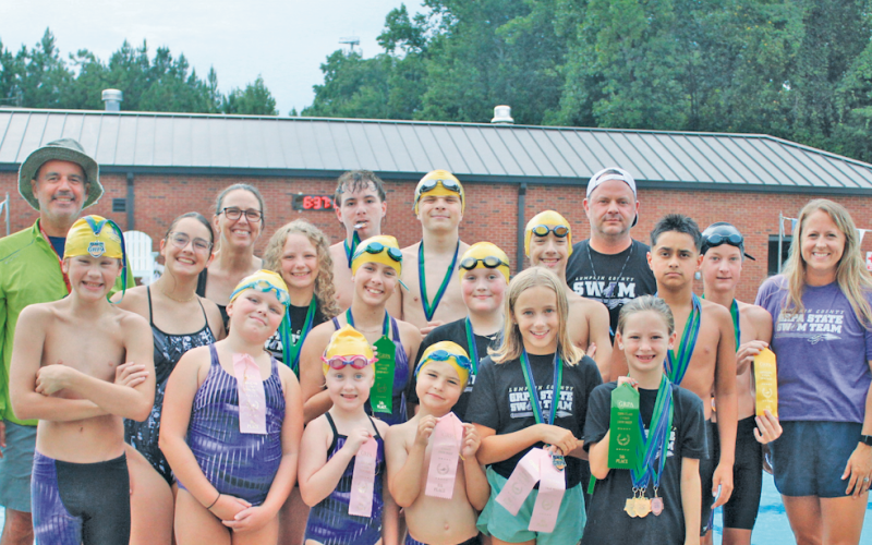 The Lumpkin Parks &amp; Rec swim team gathers for a photo back at home, after their successful performance at State.