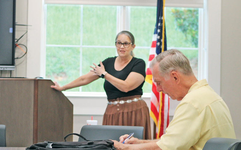 A local resident takes notes as Anita Anderson Spangler with Citizens for a Free Lumpkin speaks during a recent Homestead Property Tax Relief Seminar held in the library’s meeting room.