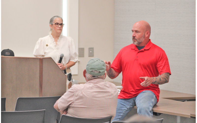 Matthew Cook said he didn’t disagree with the Sheriff’s remarks about the efficacy of the Flock camera system. “It’s a great tool, and he told you about the policies for how it’s supposed to be used. The problem is, ‘supposed to’ doesn’t always work,” Cook said, as townhall host Anita Anderson Spangler looked on.