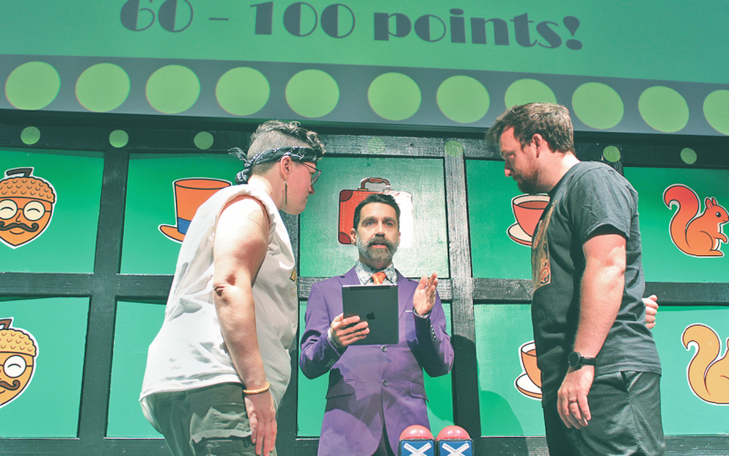 Contestants face off in a heated buzzer battle during Planet Acorn’s The Game Show Dahlonega.