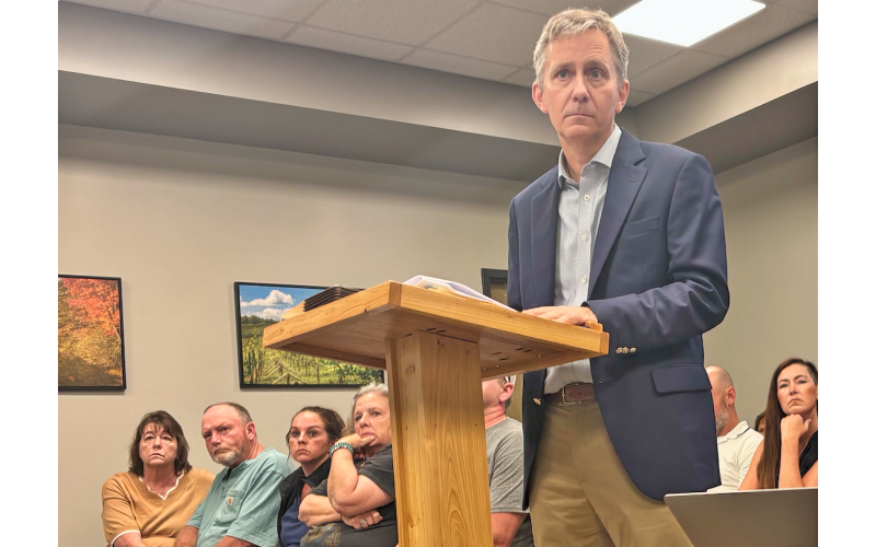 Patton Hahn stands at the podium during a packed Lumpkin County Planning Commission meeting last Monday.