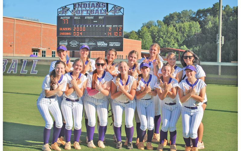 The Lady Indians celebrate their win over the Barrow Arts and Science Academy.