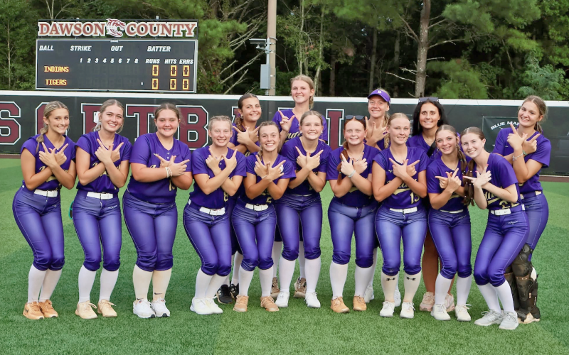 The Lady Indians celebrate their win over The Tigers on Dawson County’s field.