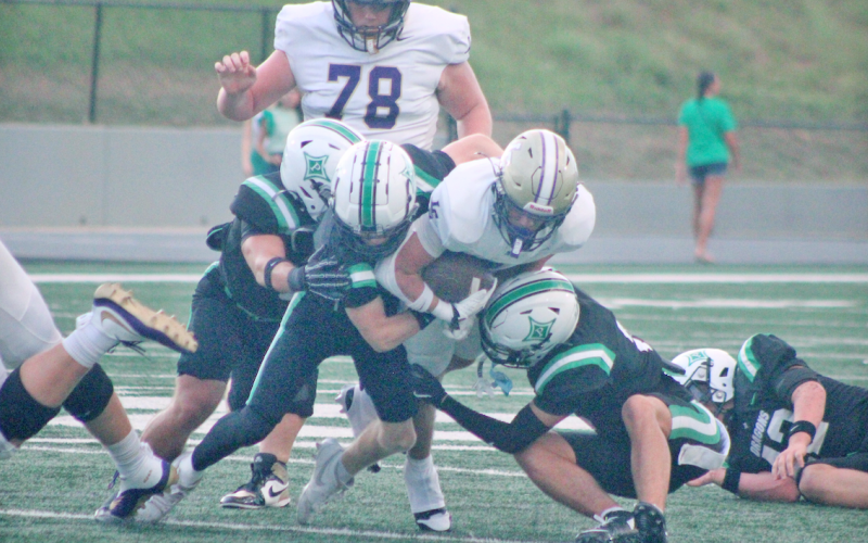 Alvarez fights for extra yards en route to his record-breaking performance of 318 rushing yards.