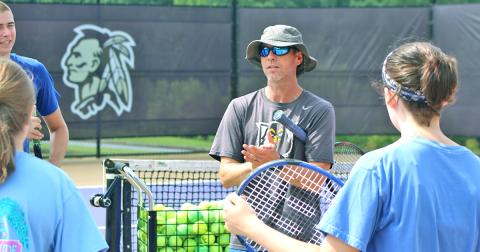 UNG head tennis coach Kent Norsworthy talks to campers at the LCHS Tennis Camp.