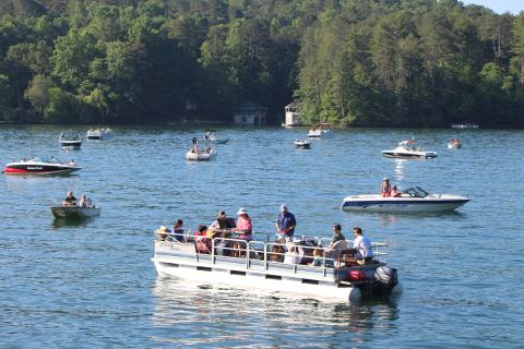 Boats gather on Lake Rabun for boat church, a service of Clayton First United Methodist Church. PHOTO/MEGAN BROOME
