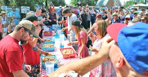 A total of 11 participants came to downtown Dahlonega to compete for a $100 prize and the honor of being the first Fourth of July hot dog eating contest champion.