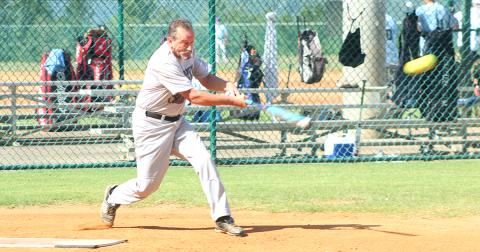 Miners player Jerome “Jackhammer” Kitchens connects for a RBI single in Lumpkin County’s game one win over the Franklin Old Bones last week. Kitchens went 5-for-7 during the Clayton League doubleheader.