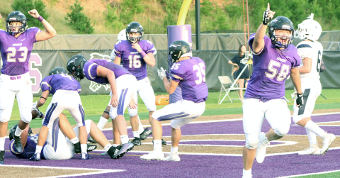 Indians defender Joseph Thomas celebrates after blocking a punt into the end zone. Aaron Hopkins fell on the ball for Lumpkin’s first touchdown in its season opener last Friday night.