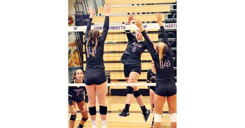 Mackenzie Caldwell delivers a powerful spike for a Lumpkin point during the team’s season opening match against North Forsyth.