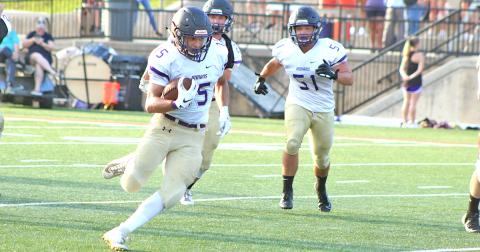 Lumpkin County High School wide receiver Trey Wilkes finds space in the secondary for some extra yards after pulling in a pass from LCHS quarterback Tucker Kirk.