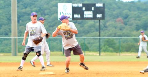 Lumpkin shortstop Wayne "Got Em" Gaddis turns a double play during the Miners' matchup with the Gordy Scargle Division leading Hendersonville Sluggers.