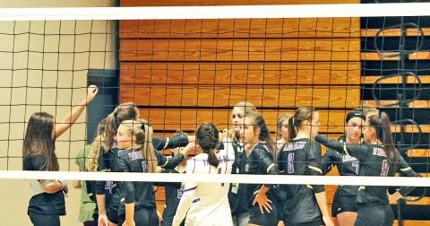 The LCHS varsity volleyball team gets pumped up before a match. The Lady Indians have won eight of their last 10 games, improving their overall record to 12-9.