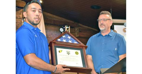 Recently returned Georgia National Guard 2nd Lt. Edgar Rojas (left) presents Pastor Jeff Pullium of Concord at Dahlonega with the flag that flew over the base at Nangarhar Province, Afghanistan where he was stationed. The presentation took place during the church’s recent Warrior Welcome Home celebration.