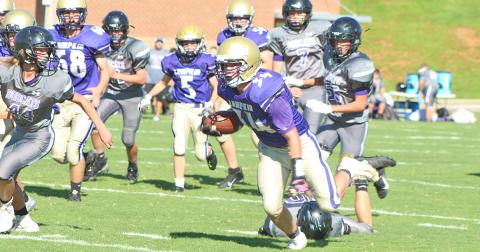 Running back Will Wood keeps his feet after avoiding a tackle on his way to one of his two touchdowns for the Indians.
