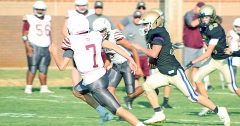 Running back Will Wood runs by two Dawson defenders on his way to his second touchdown of the day in the Indians’ 22-14 victory.