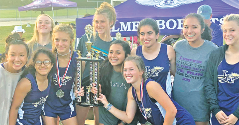 The Lady Indians cross country team shows off the hardware they earned after winning the Gilmer County Cross Country Invitational last week.