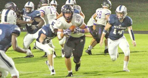 LCHS tight end Aaron Hopkins picks up some yards after catching a pass from Indians quarterback Tucker Kirk in the third quarter of Lumpkin’s game against White County last week.