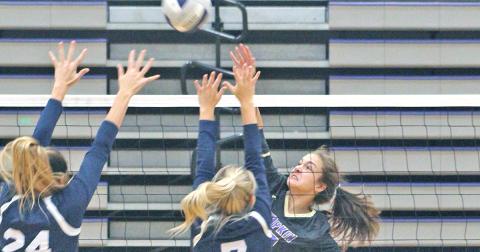 Lady Indians freshman Mary Mullinax gets aggressive at the net for a kill versus West Hall at the Longhouse at the LCHS gymnasium last week.