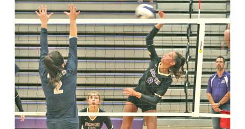Lady Indians player Kiersta Trammell puts a powerful hit on the ball at the net for a kill during Lumpkin’s win over Prince Avenue Christian last week.