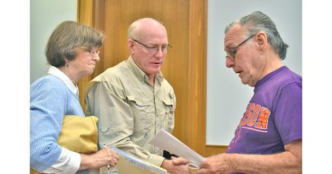 Dr. Laurel and Kurt Massey share a copy of a proposed resolution to declare Lumpkin County to be a “Sanctuary for Pre-born Life” with Byron Jeffries.