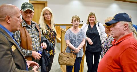 County Commissioner Jeffrey Moran talked with residents in the McDonald Mill subdivision after last week’s BOC meeting. They were there to voice their concerns about two short term rental properties in their neighborhood.
