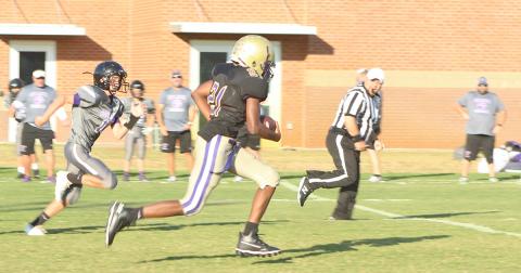 LCMS standout Gerald Walker returns an interception for a touchdown in the 7th grade team’s blowout win over Gilmer County in the Mountain League semifinals.