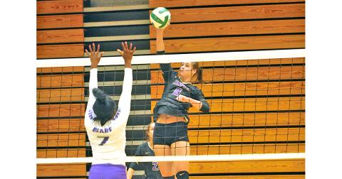 Lady Indians player Makenzie Caldwell gets up high to put a powerful spike on the ball. Caldwell was one of two Lady Indians to be named to the All-Area Team.