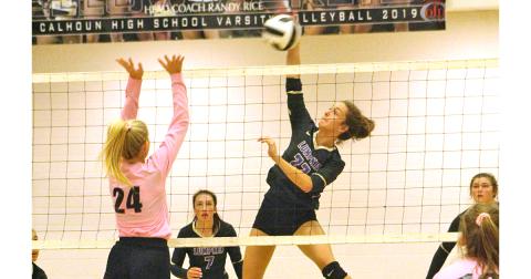 Freshman Mary Mullinax gets up high for a powerful spike during the Lady Indians’ State Playoff match versus Calhoun.