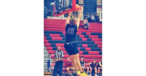 Indians player Peyton Polk adds an exclamation point on a fast break with a two-handed dunk against the Jackson County Panthers.