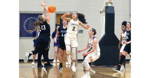 Lumpkin County’s Isabel Davenport forces a Lady Leopard turnover with her tenacious defense.