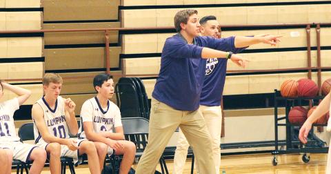 First-year middle school head boys basketball coach Daniel McCrary directs his players during their game against the Pickens County Dragons at the LCMS gym last week.