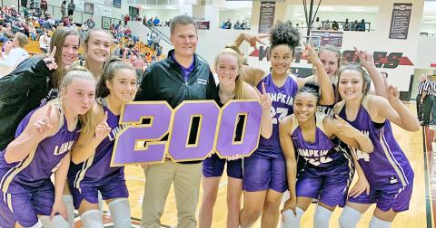 The Lady Indians celebrate LCHS head girls basketball coach David Dowse’s 200th career win after defeating the Chestatee Lady War Eagles in Lumpkin’s 2019-2020 season opener.